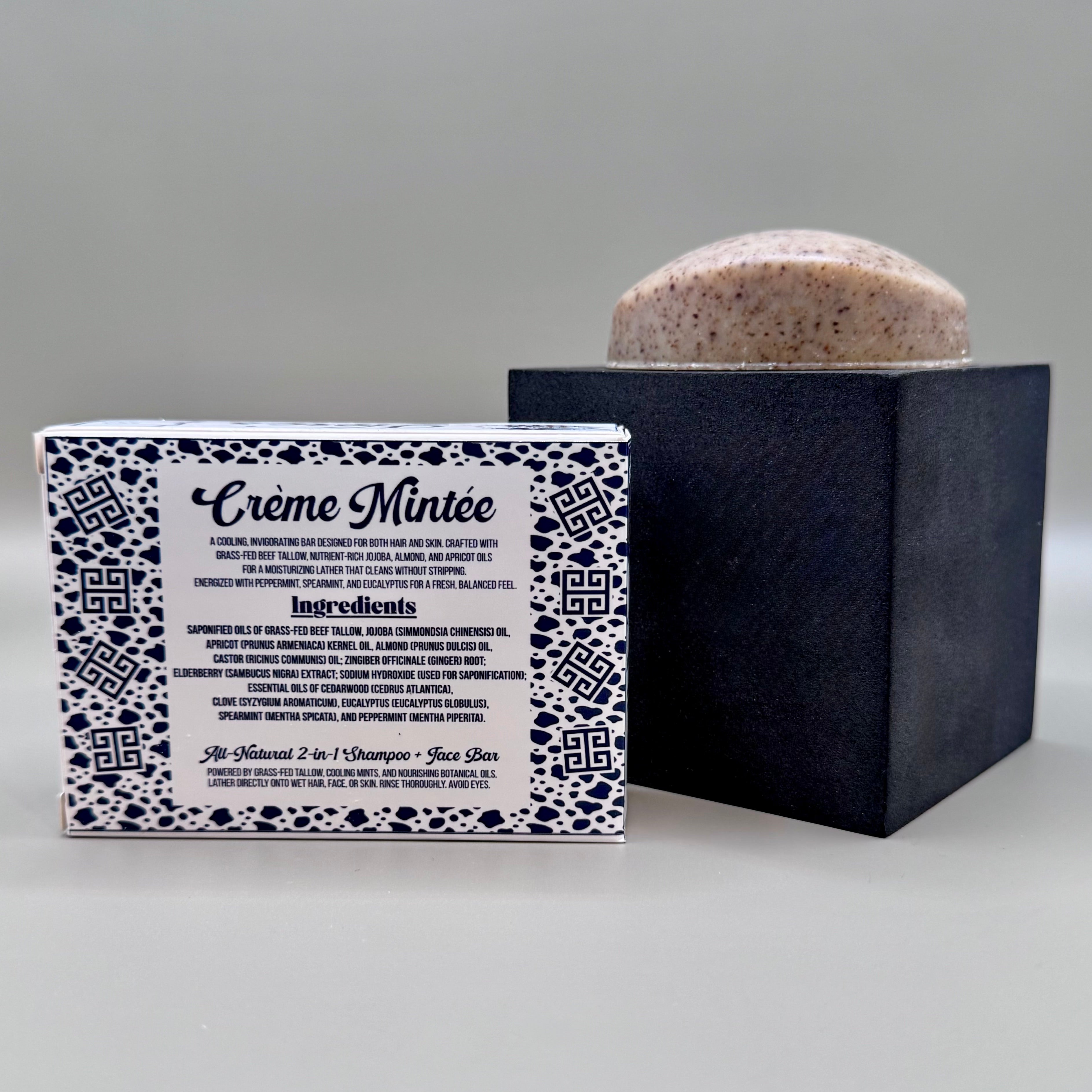 Bar of soap with packaging labeled 'Crème Minté' on a gray background
