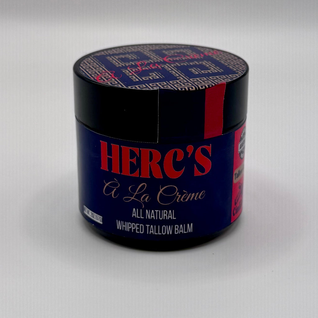 Jar of Herc's A La Creme whipped tallow balm on a white background